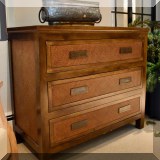 F44. Rattan three-drawer chest. 